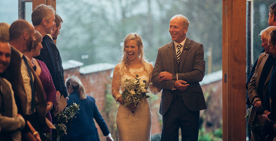 Father walks his daughter down the aisle