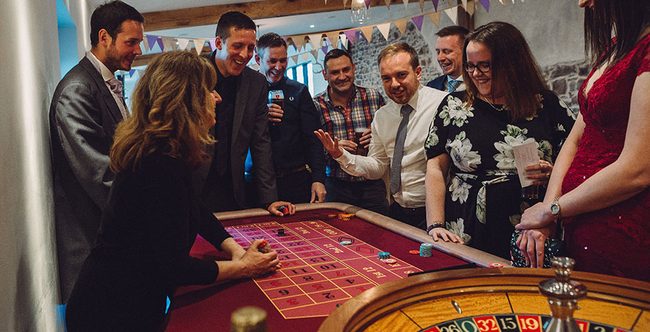 Roulette table surounded by wedding guests