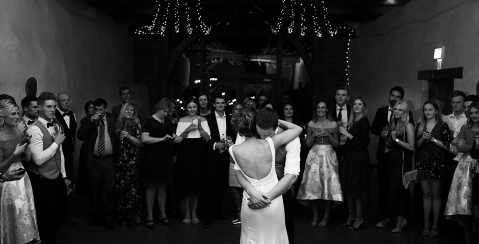 Tight embrace of couple during their first dance