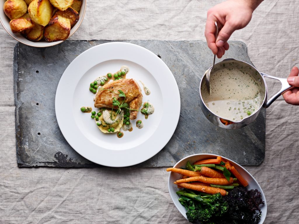 Butter roast chicken, pea and mint tortellini, fresh peas and a truffled chicken veloute