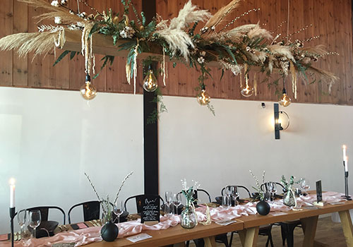 Hanging oak beam with industrial Edison lights